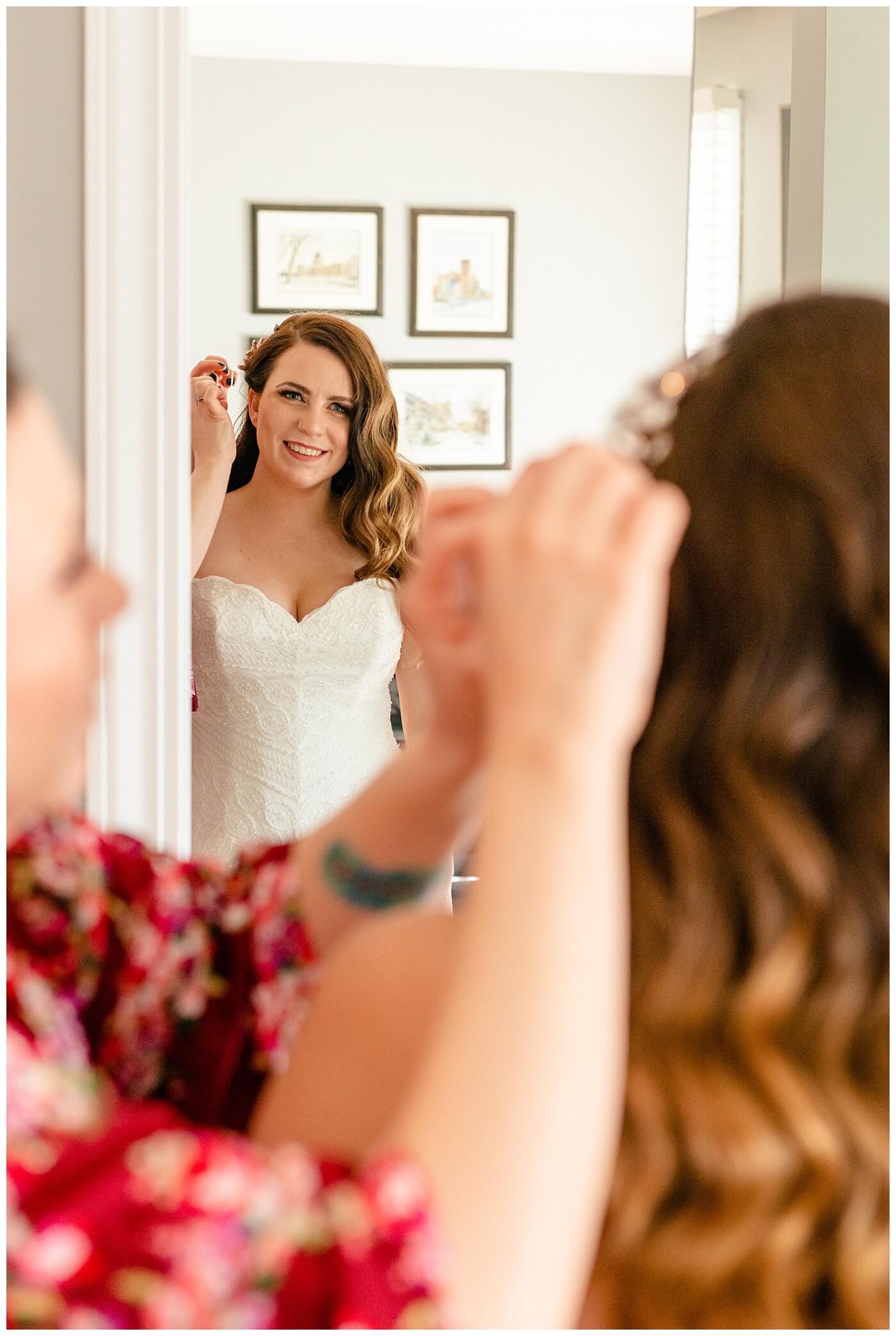 Regina Wedding Photographer - Tim & Jennelle At Home Wedding - Bride final touches with hair clip