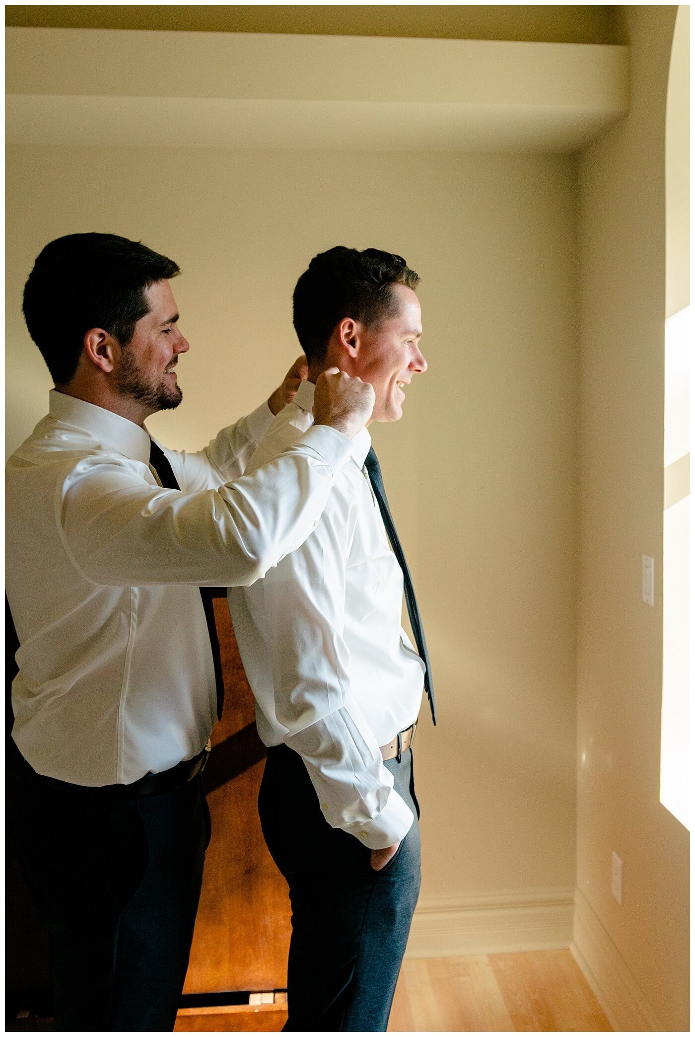 Regina Wedding Photographer - Tim & Jennelle At Home Wedding - Bestman helping with groom's collar