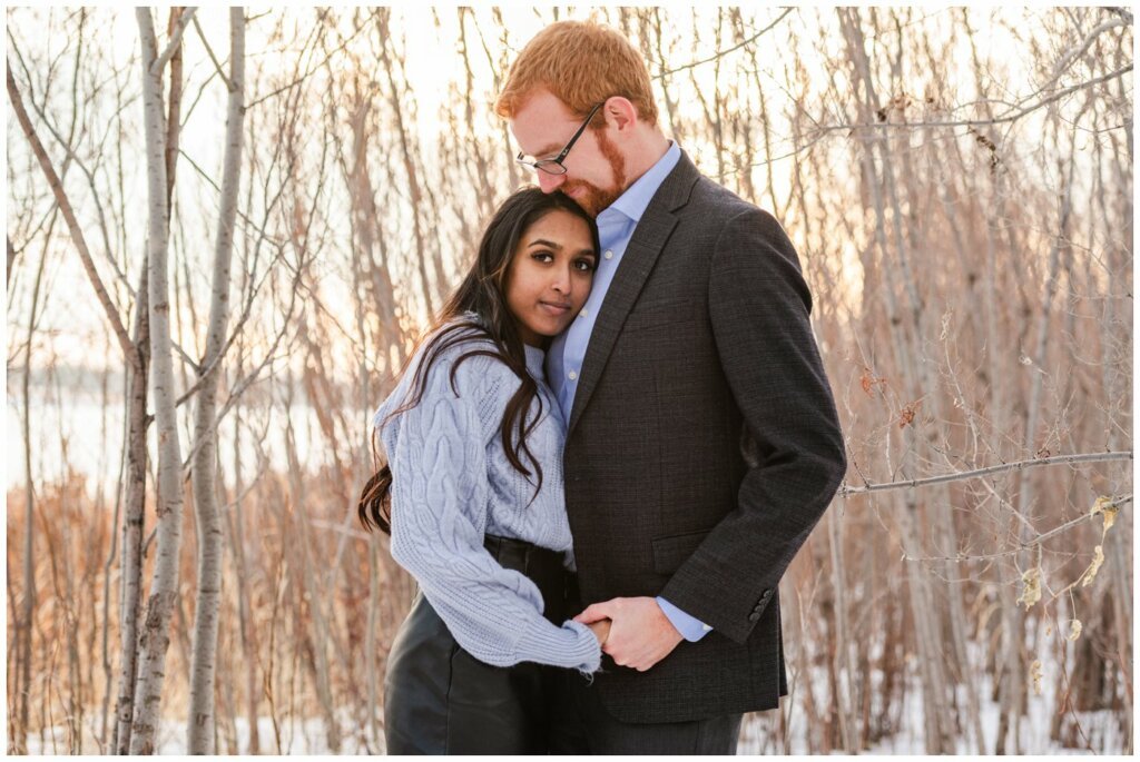 Regina Engagement Photography - Stephen & Sarah - 007 - Sarah Looking at camera in woods 