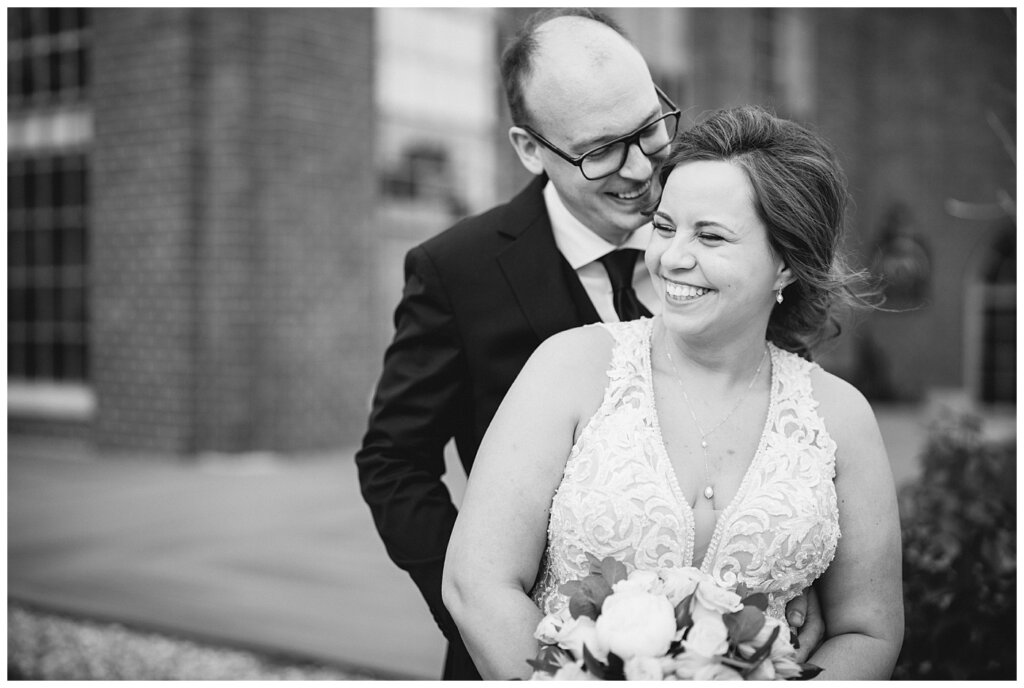 Black and white photo of bride and groom at portrait session