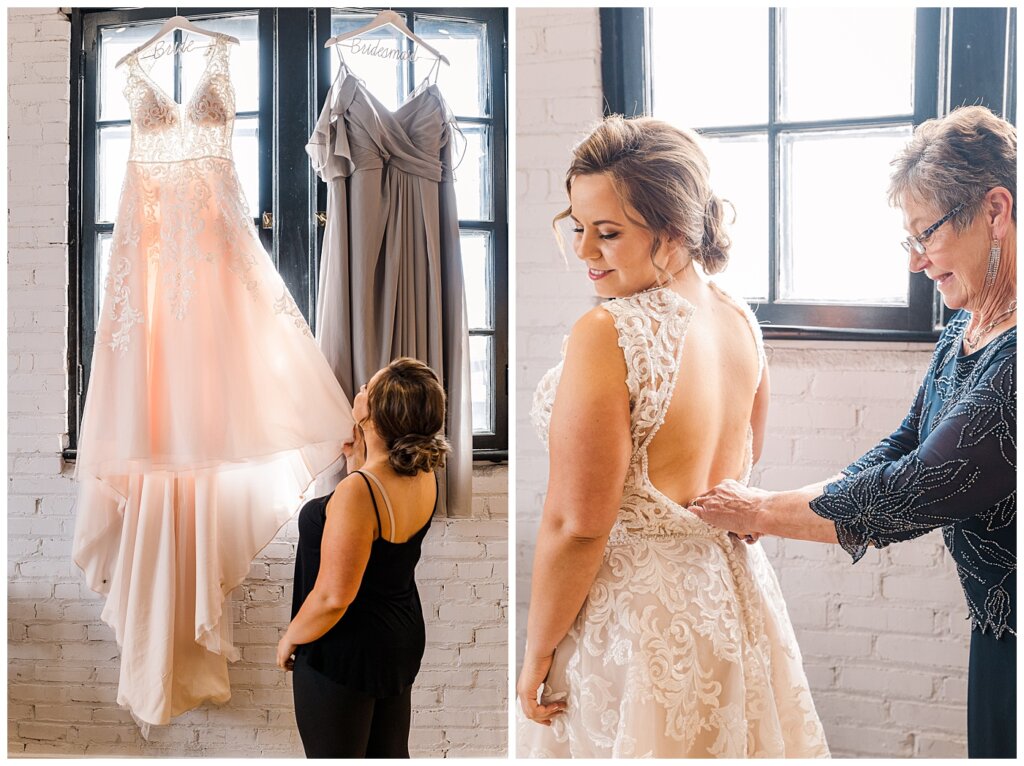 Bride looking at Newline Fashions wedding dress and mom doing up bride's dress
