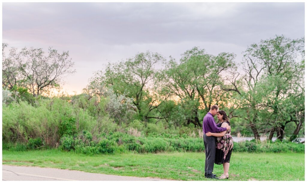 Sheldon & Amy - Engagement Session - 010 - Couple praying over marriage at sunset