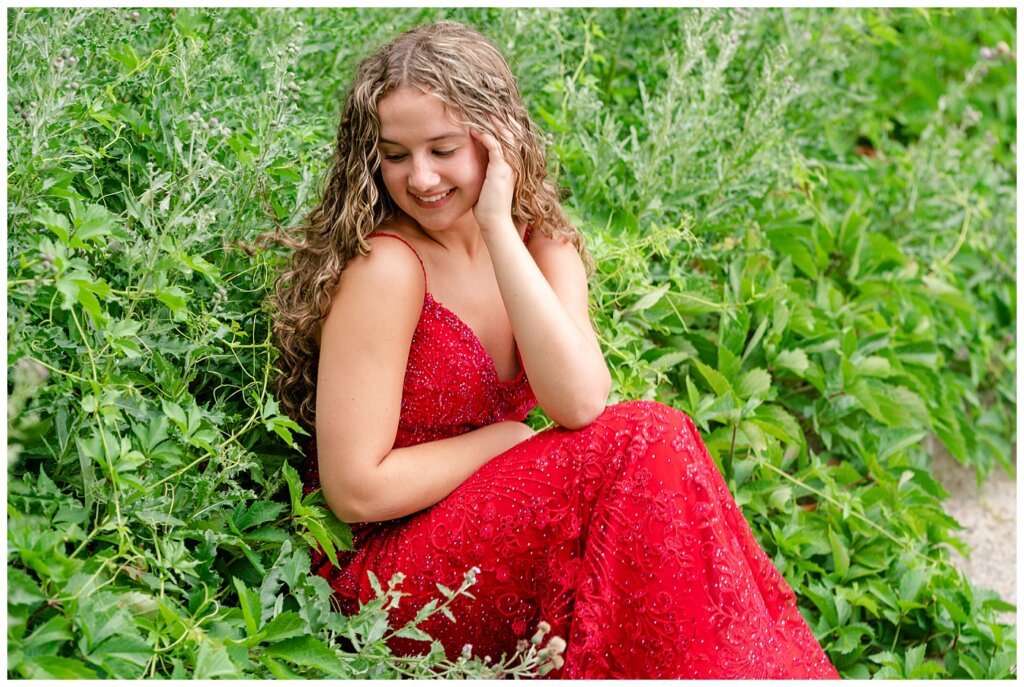 Cailey Baseden - Graduation 2021 - 08 - High school senior sitting among the weeds