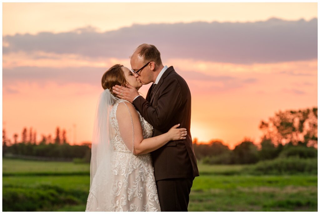 Colter & Jillyan - Encore Wedding Session - 16 - Sunset kiss of Bride and Groom