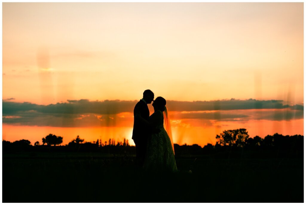 Colter & Jillyan - Encore Wedding Session - 17 - Silhouette of Bride & Groom at Sunset