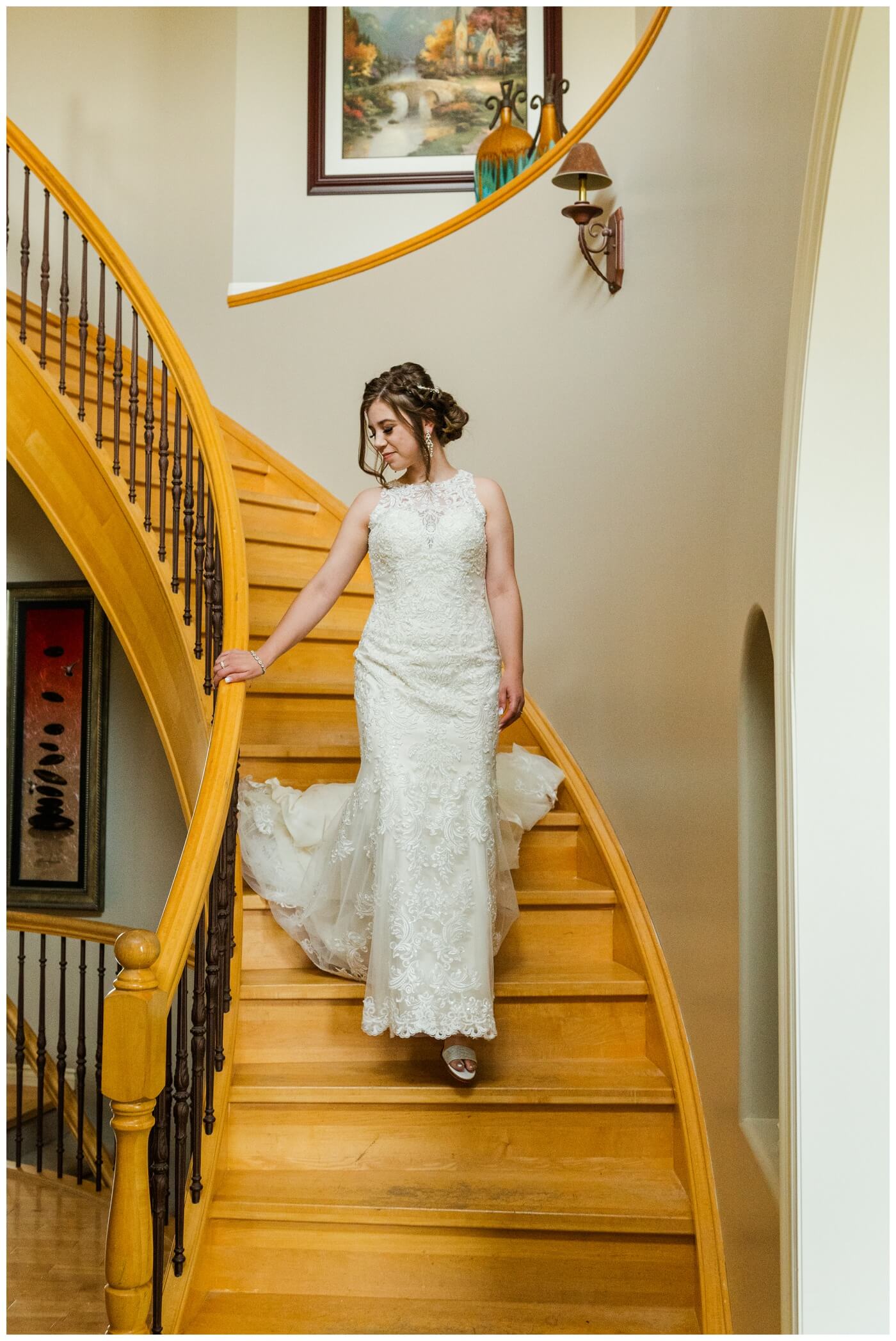 Dominik & Chelsea - Moose Jaw Wedding - 10 - Bride descending staircase in W Bridals dress