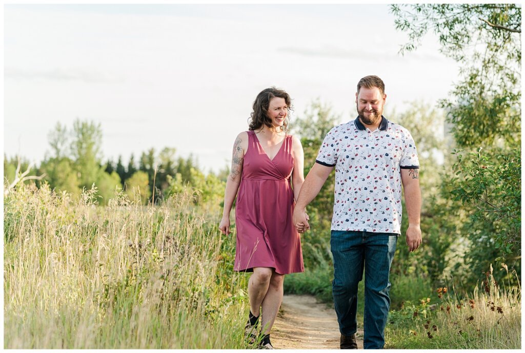 Mitch & Val - Engagement Session in Wascana Habitat Conservation Area - 01 - Engaged couple walking through park