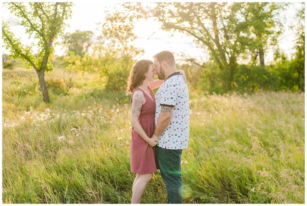 Mitch & Val - Engagement Session in Wascana Habitat Conservation Area - 03 - Man gently kisses fiancee on the nose