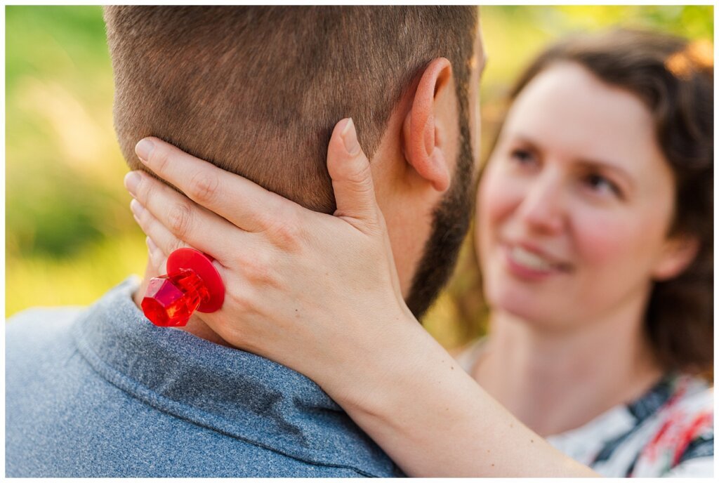 Mitch & Val - Engagement Session in Wascana Habitat Conservation Area - 08 - Engaged Woman wearing a ring pop looking at her fiance