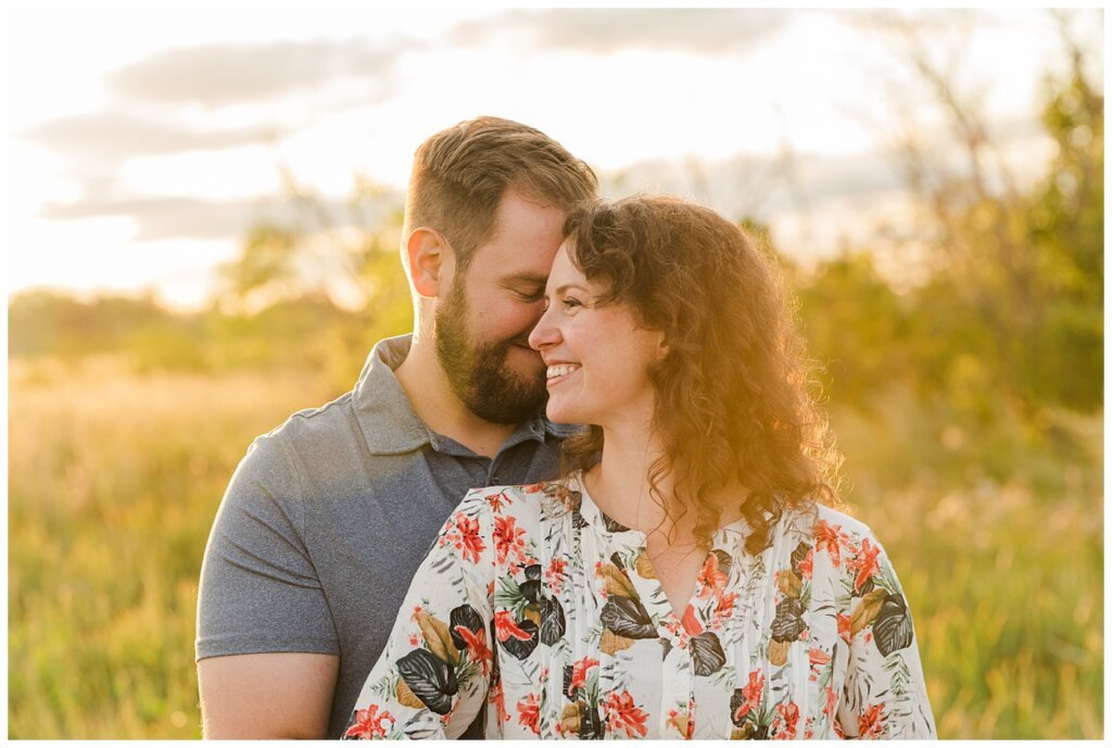 Mitch & Val - Engagement Session in Wascana Habitat Conservation Area - 10 - Man nuzzling into hair of woman