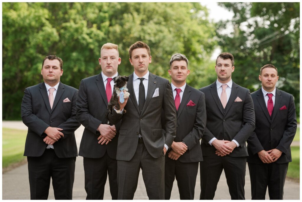 Taylor & Jolene - Emerald Park Wedding - 20 - Groom and groomsmen pose as evil geniuses