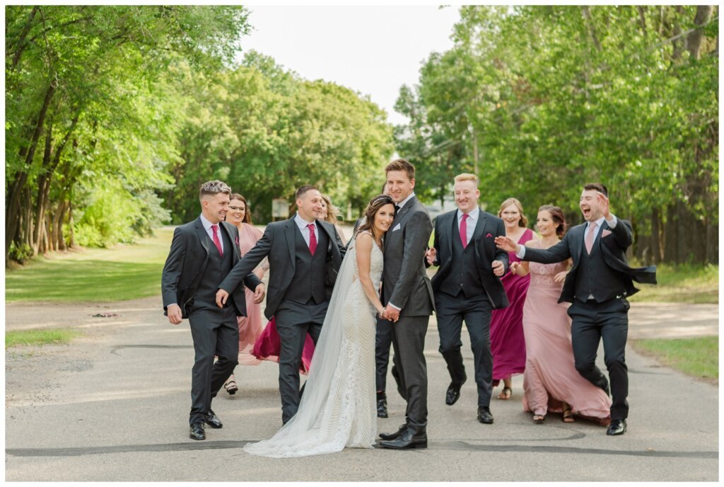 Taylor & Jolene - Emerald Park Wedding - 24 - Bridal party surprises Bride & Groom