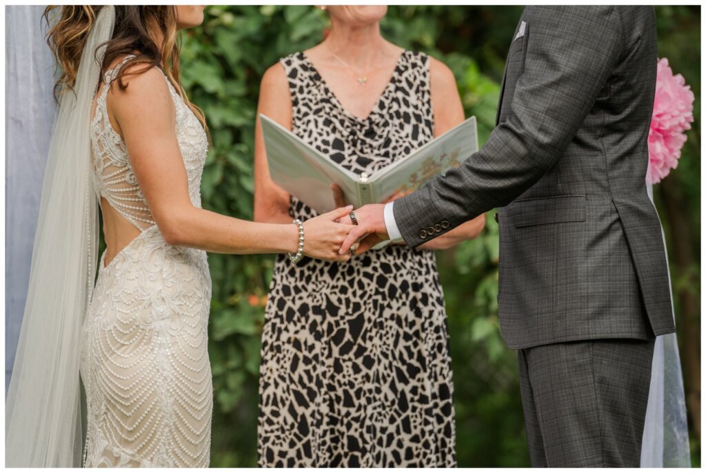 Taylor & Jolene - Emerald Park Wedding - 33 - Bride & Groom exchange rings