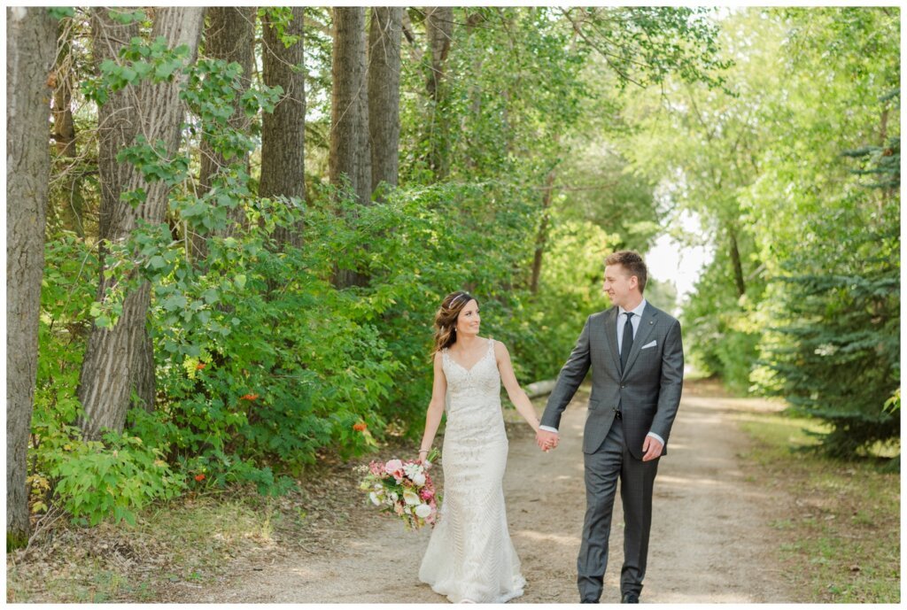 Taylor & Jolene - White City Wedding - 28 - Bride & Groom walking down the alley