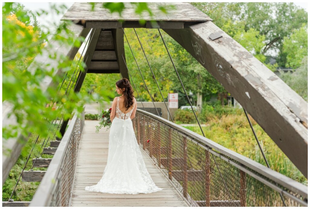 Andrew & Lacey - 27 - Bride looking down shoulder at Anais Anette Dress