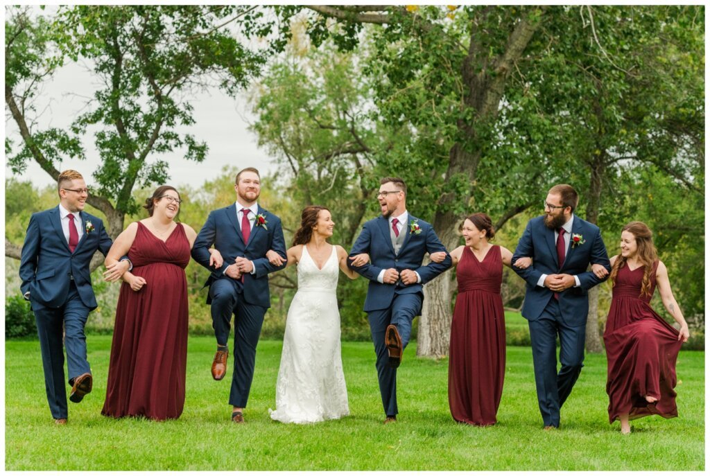 Andrew & Lacey - 29 - Wedding Party doing Wizard of Oz linking arms