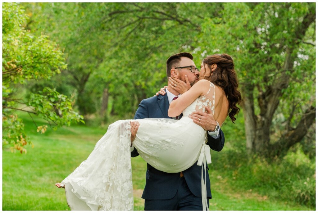 Andrew & Lacey - 31 - Groom carrying bride in Les Sherman Park