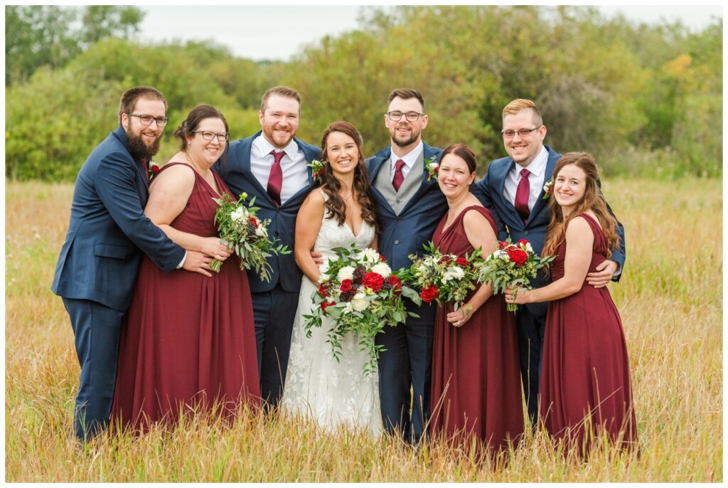 Andrew & Lacey - 33 - Wedding Party in group hug at White Butte Trails