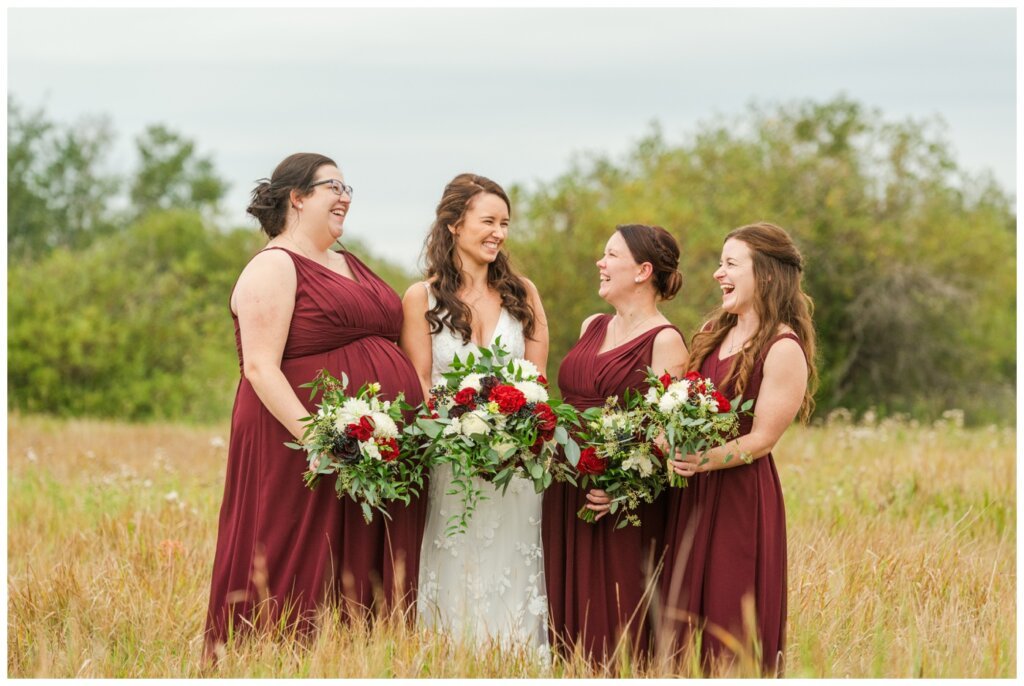 Andrew & Lacey - 34 - Bridal Party laughing in a field