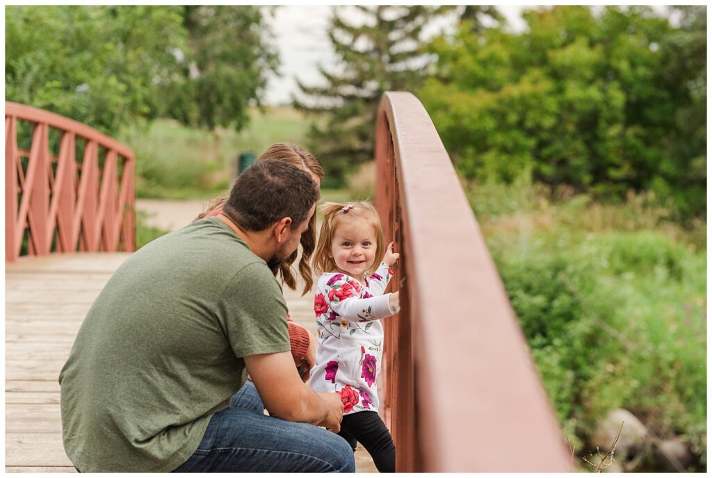 Eyre Family 2021 - AE Wilson Park - Family Photo Shoot - 02 - Daughter smiles on the bridge