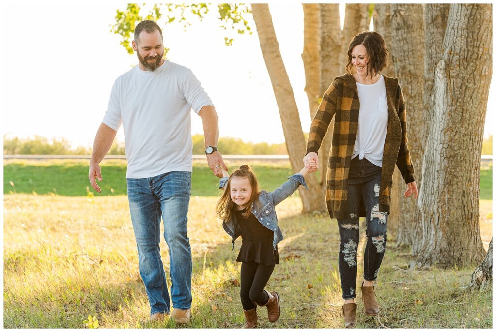 Kim & Lisa Korchinski - White Butte Trails - Family Photo Session 2021 - 01 - Daughter pulling parents