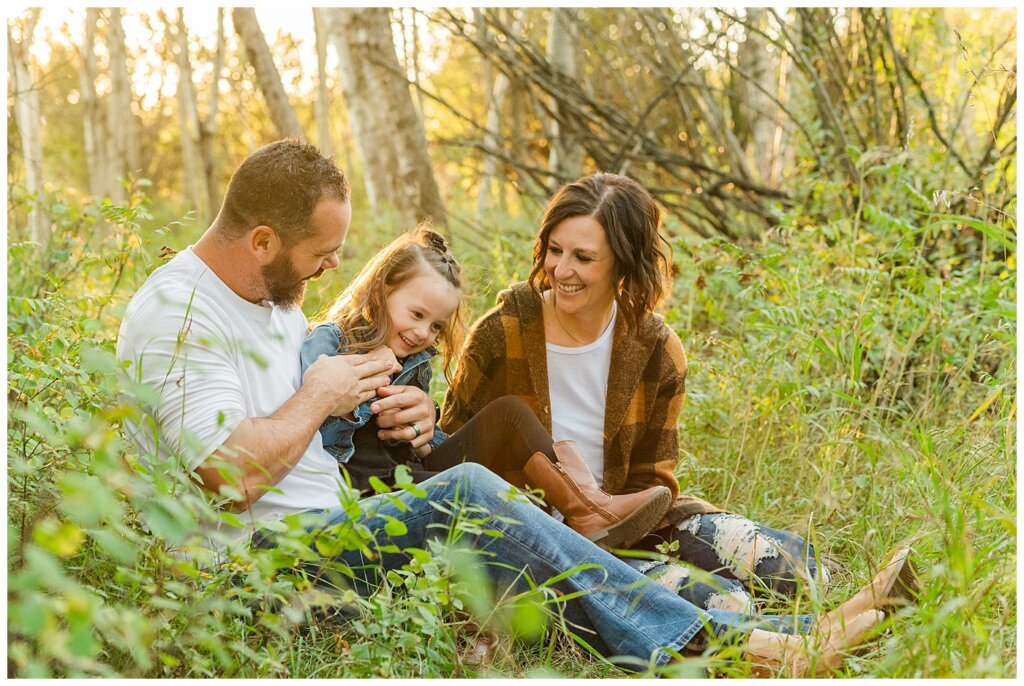 Kim & Lisa Korchinski - White Butte Trails - Family Photo Session 2021 - 05 - Dad tickling daughter in the forest