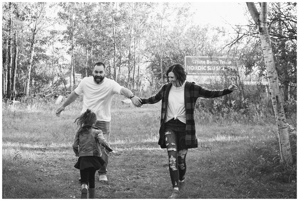 Kim & Lisa Korchinski - White Butte Trails - Family Photo Session 2021 - 10 - Father pretending to run away from daughter