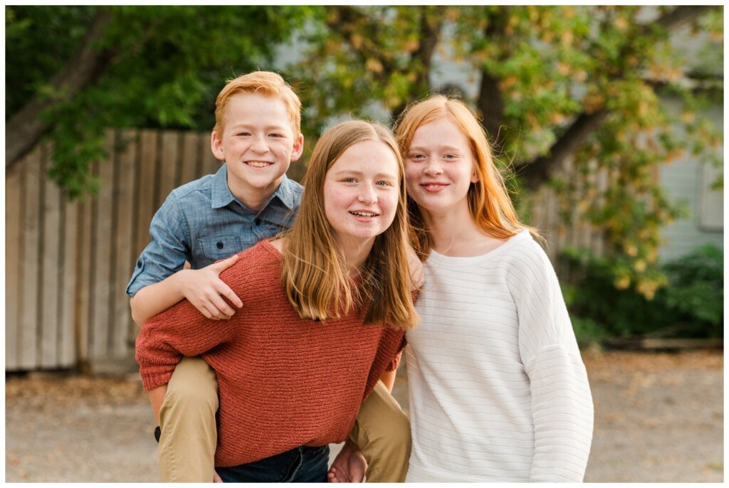 Schoenroth Family - Cathedral Village Regina - 05 - Siblings walk through alley