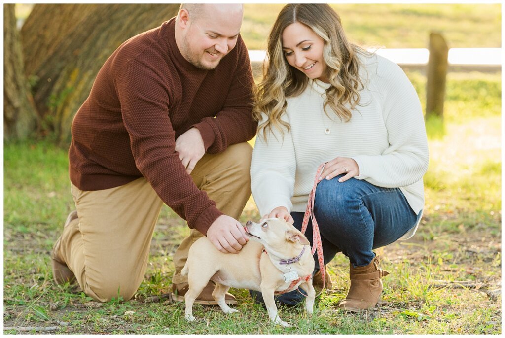 Trevor & Kim - Regina Engagement Session - Wascana Centre Habitat Conservation Area - 02 - Couple kneeling next to their puppy