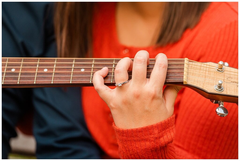 Andrew & Alisha - Engagement Session - 09 - Close up of engagement ring on woman playing acoustic guitar