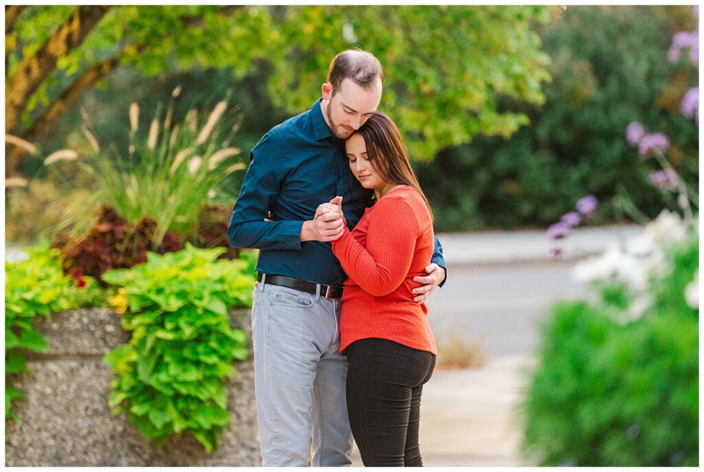 Andrew & Alisha - Regina Engagement Session - 14 - Couple dancing near Wascana Centre building