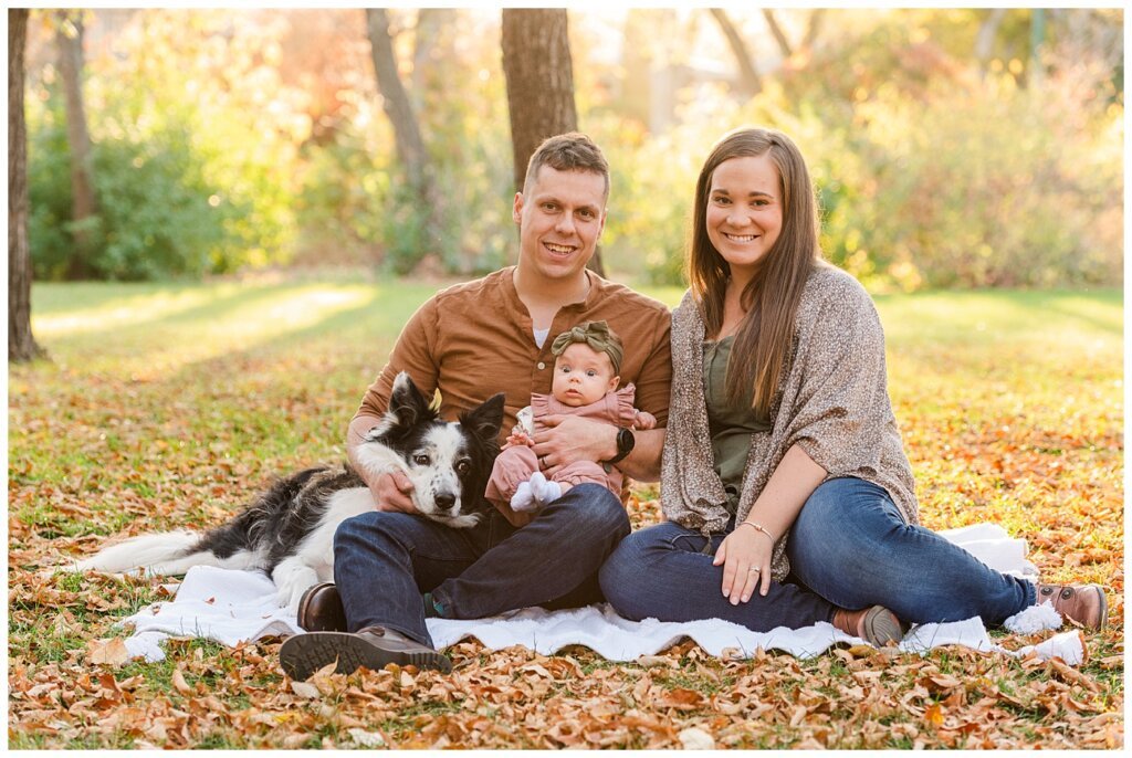 Filby Family - Regina Family Photography - Wascana Park - 01 - Family sitting in park with dog