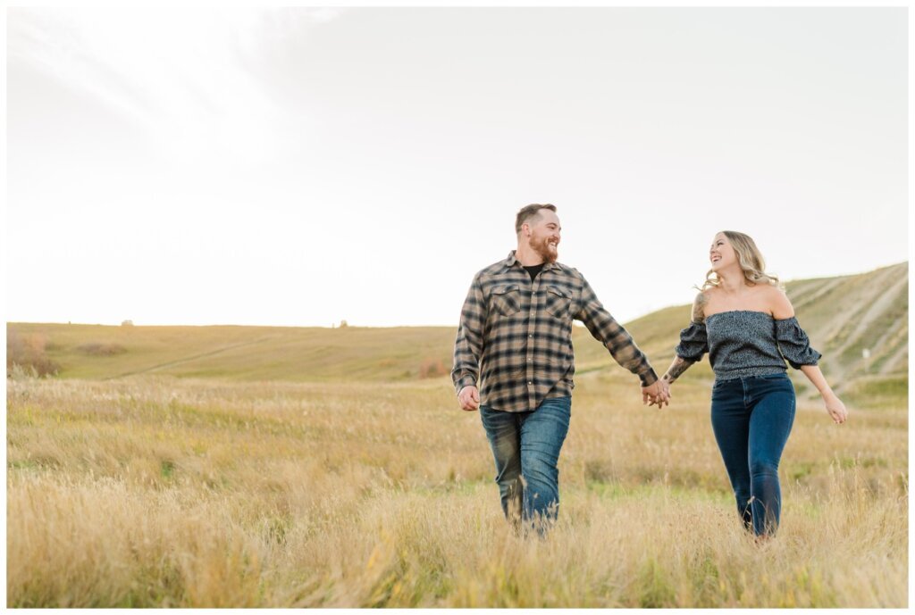 Jared & Jenna - Wascana Trails - 10 - Couple frolicking through a field