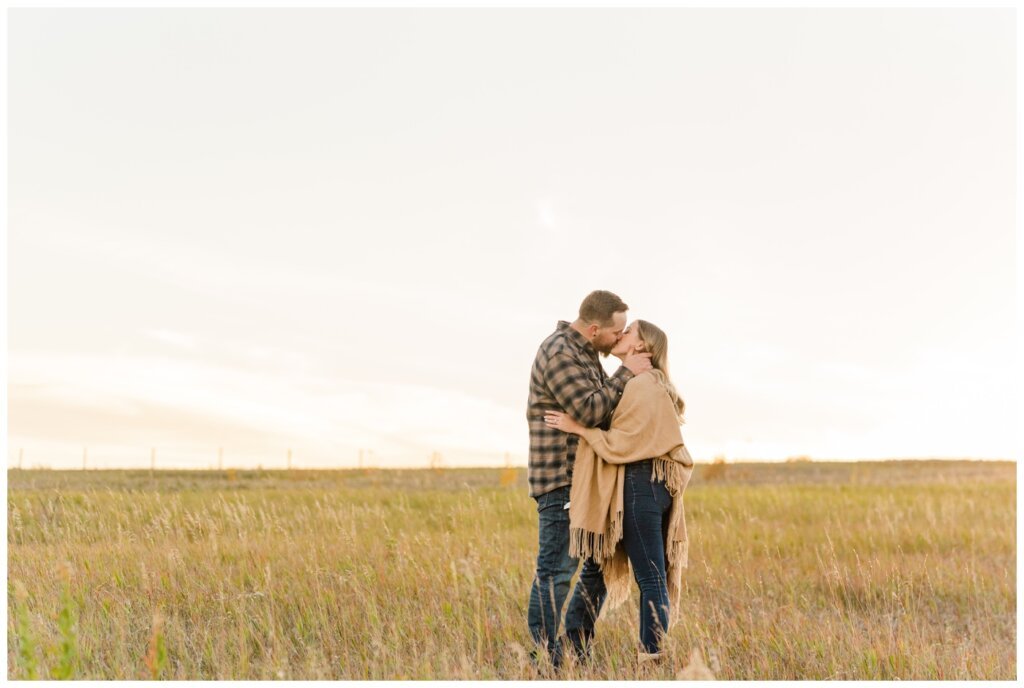 Jared & Jenna - Wascana Trails - 15 - Couple kissing nearing sunset