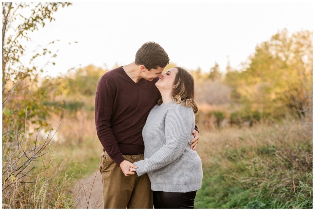 Regina Engagement Photography - Ben & Megan - Engagement Session at AE Wilson Park and Island - 07 - Ben kissing Megan