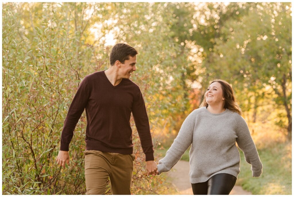 Regina Engagement Photography - Ben & Megan - Engagement Session at AE Wilson Park and Island - 10 - Couple frolicking in the park