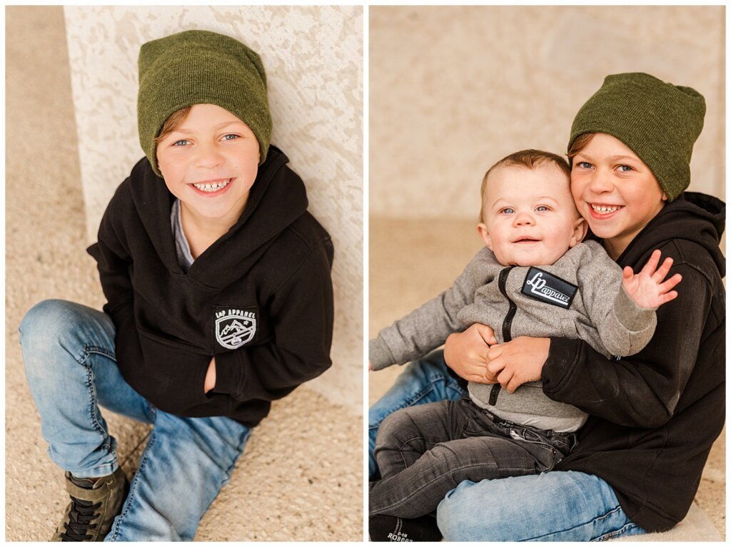 Regina Family Photographers - Keen Family - 2021 - TC Douglas Building - 07 - Shepherd holding brother Prescott