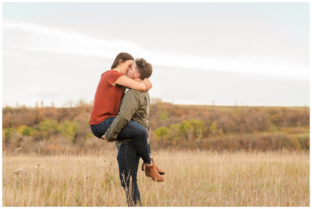 Tris & Jana - Engagement Session - Wascana Trails - 07 - Girl koala bear hugs boy while kissing