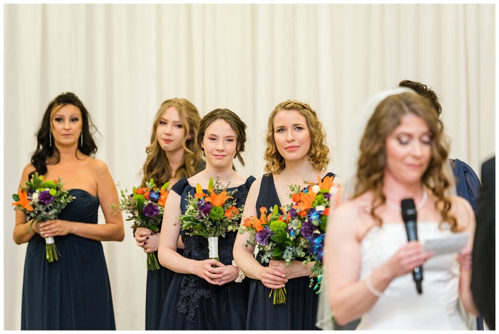 Matt & Ruth - 2022 Wedding - Queensbury Convention Centre - Regina Wedding - Bridesmaids react as bride reads her vows
