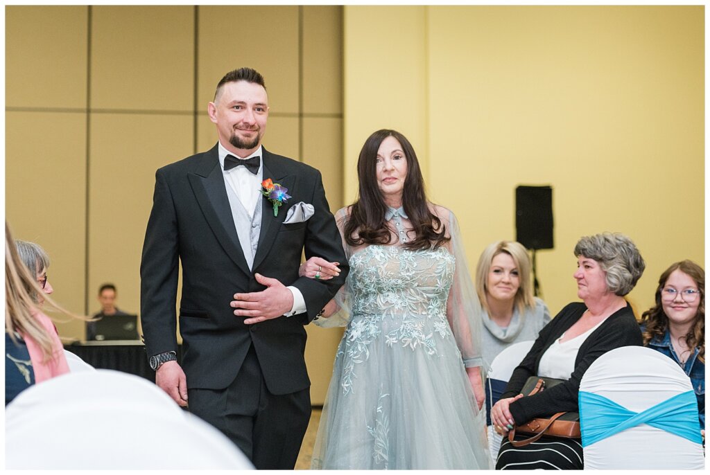 Matt & Ruth - 2022 Wedding - Queensbury Convention Centre - Regina Wedding - Groom escorted by his mother
