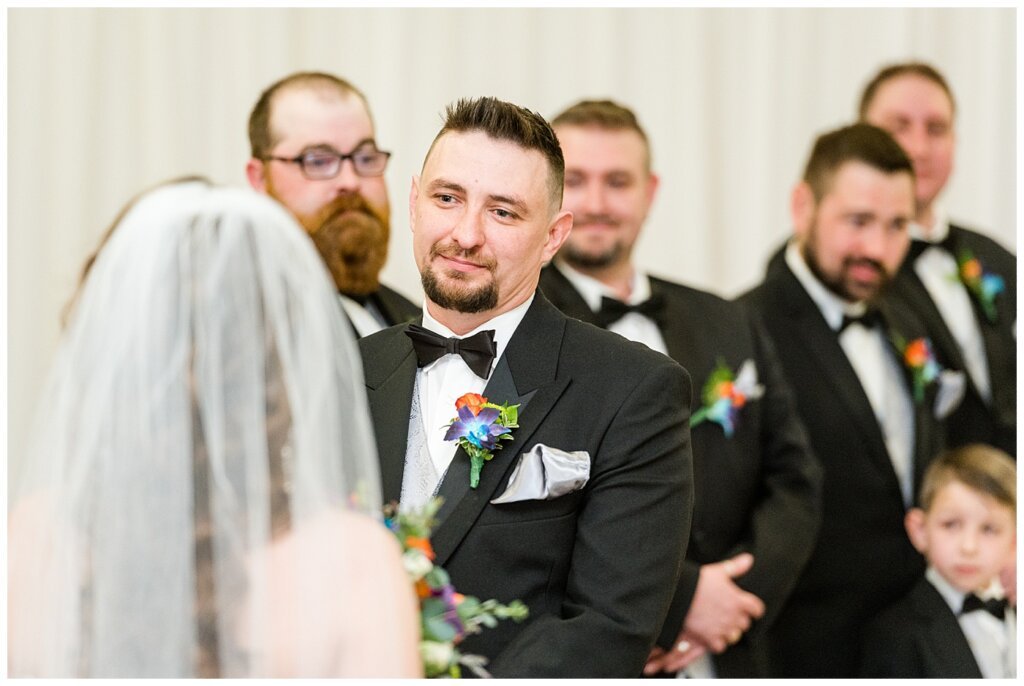 Matt & Ruth - 2022 Wedding - Queensbury Convention Centre - Regina Wedding - Groom listens as bride makes her vows