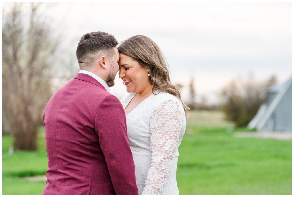 Couple forehead to forehead at engagement session in Grand Coulee