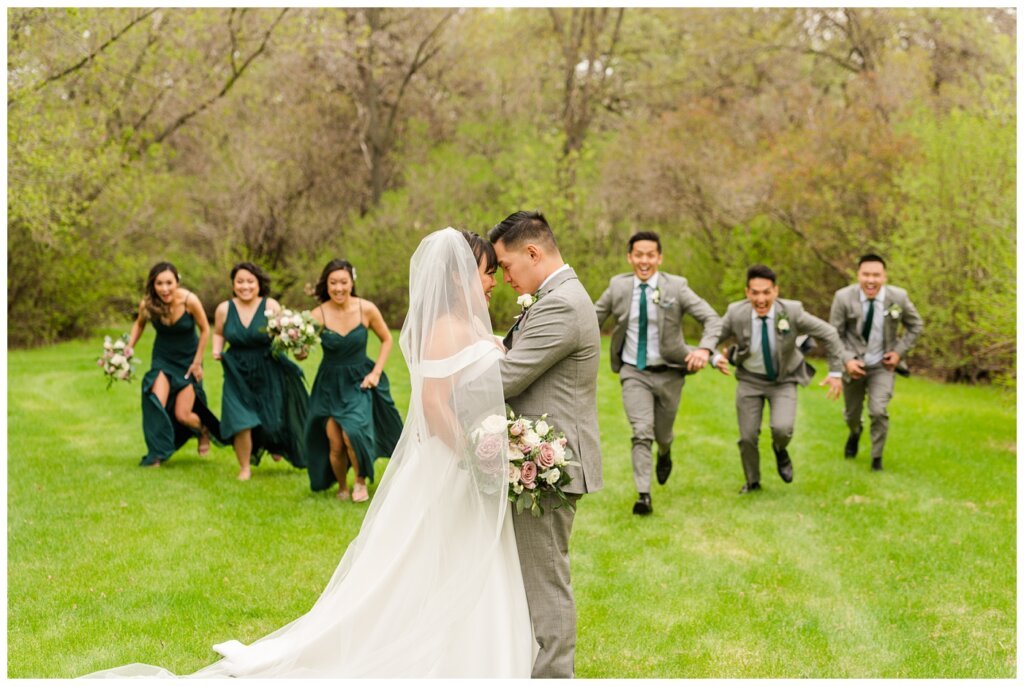 Sam & Benton - Wascana Park - 24 - Bride & groom rushed by the bridal party