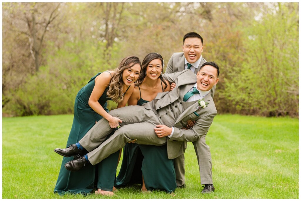 Sam & Benton - Wascana Park - 27 - New siblings in-law lift groom