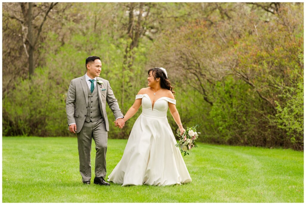 Sam & Benton - Wascana Park - 31 - Bride & groom walk together