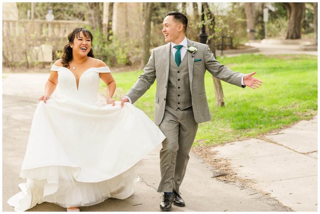 Sam & Benton - Wascana Park - 32 - Bride & groom frolic through the park