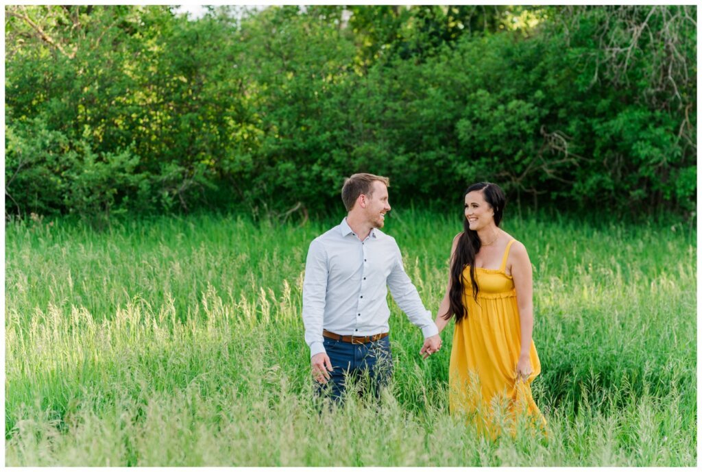 Adam Caitlin 02 Lumsden Valley Couple walks through tall grass