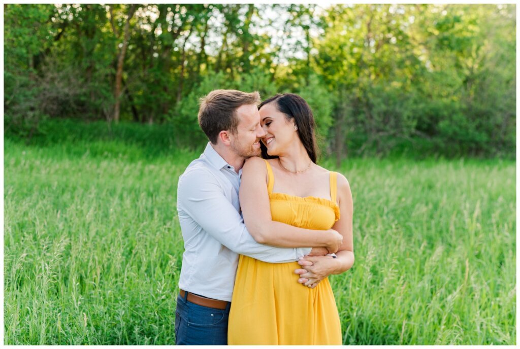 Adam Caitlin 08 Lumsden Valley Fiance wraps up his bride to be in a yellow dress