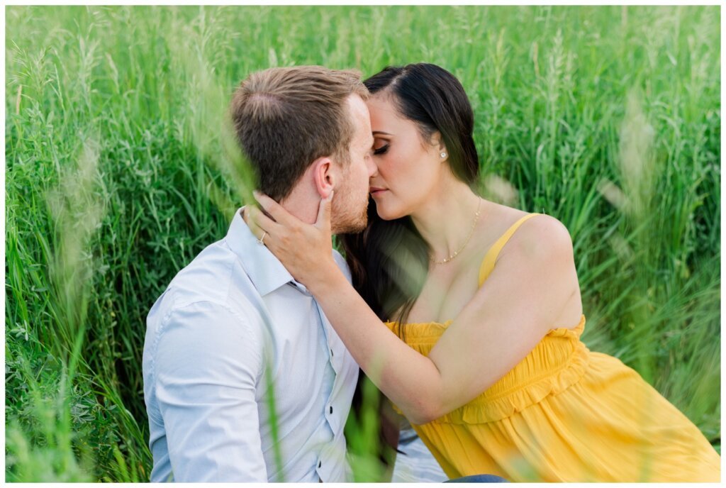 Adam Caitlin 09 Lumsden Valley Couple sit amongst the tall grass in an intimate moment