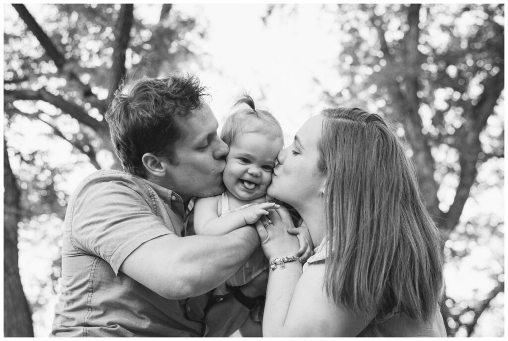 Filby Family 2022 - 12 - Saskatchewan Science Centre - Mom & Dad kiss toddler